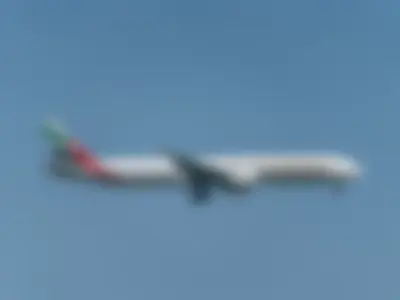 Emirates Boeing B777-31HER (registration number A6-EQG) making final approach to the runway 22L