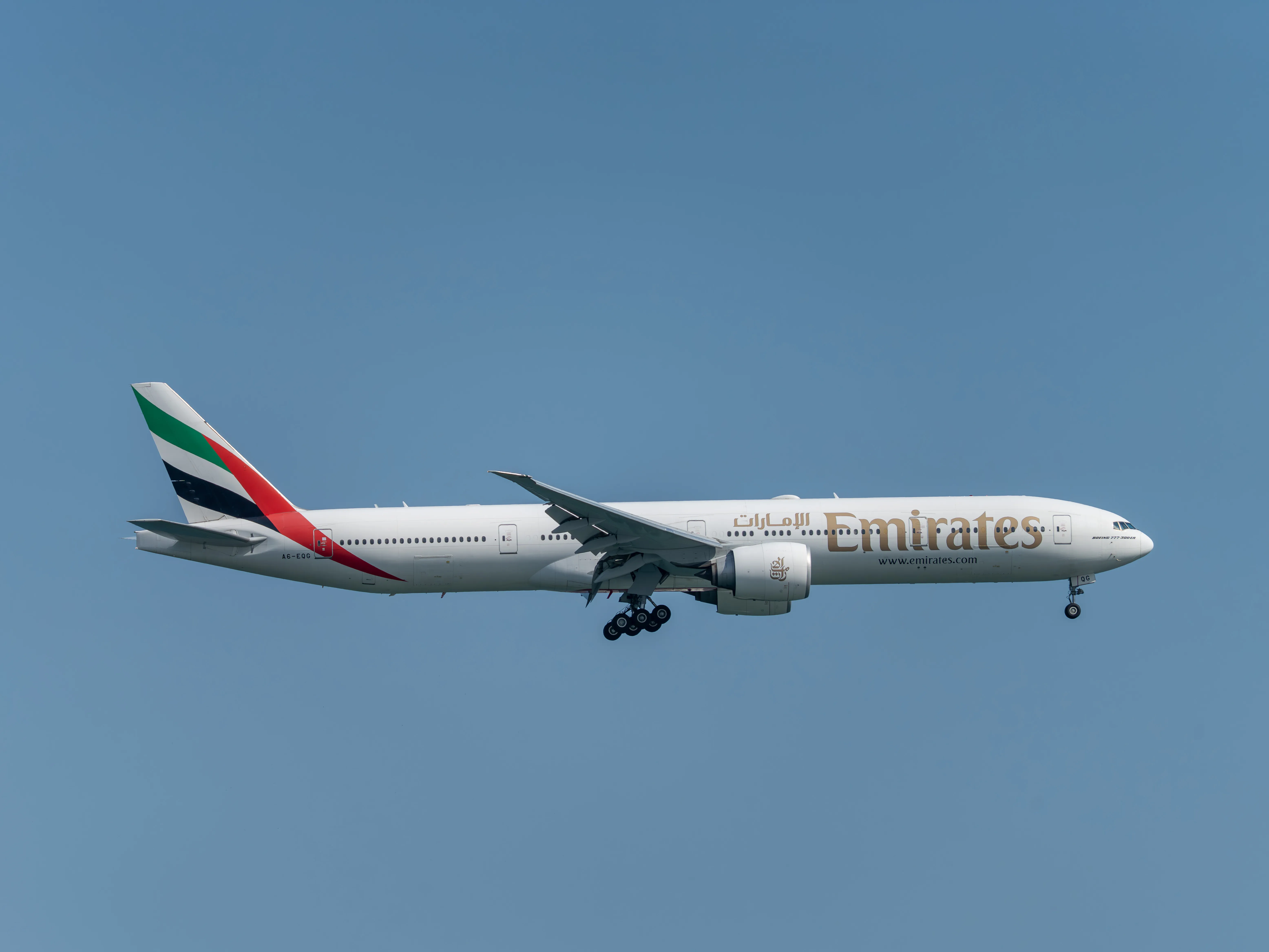 Emirates Boeing B777-31HER (registration number A6-EQG) making final approach to the runway 22L