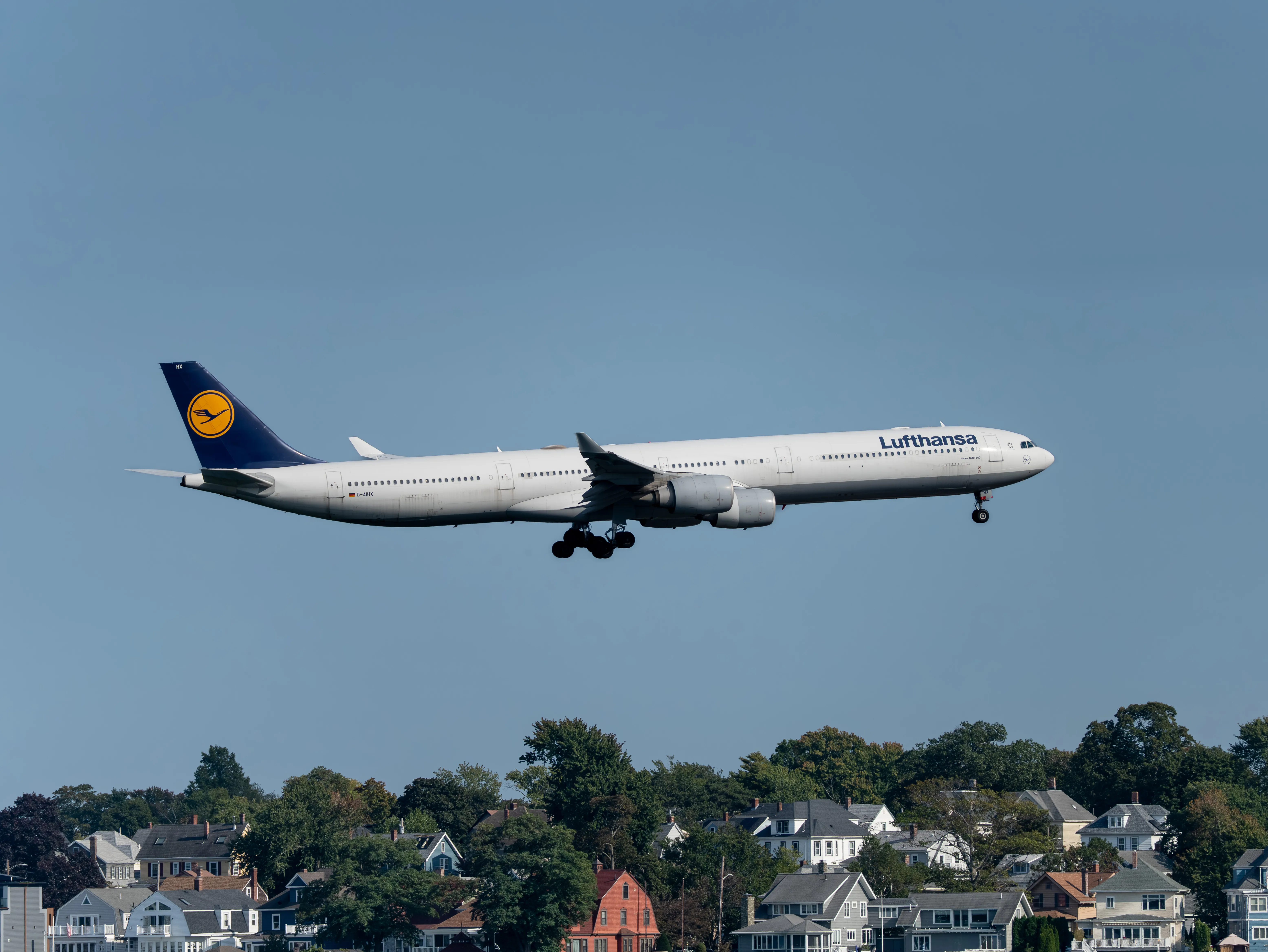 Lufthansa Airbus A340-600 (registration number D-AIHX) is making final approach to the runway 22L