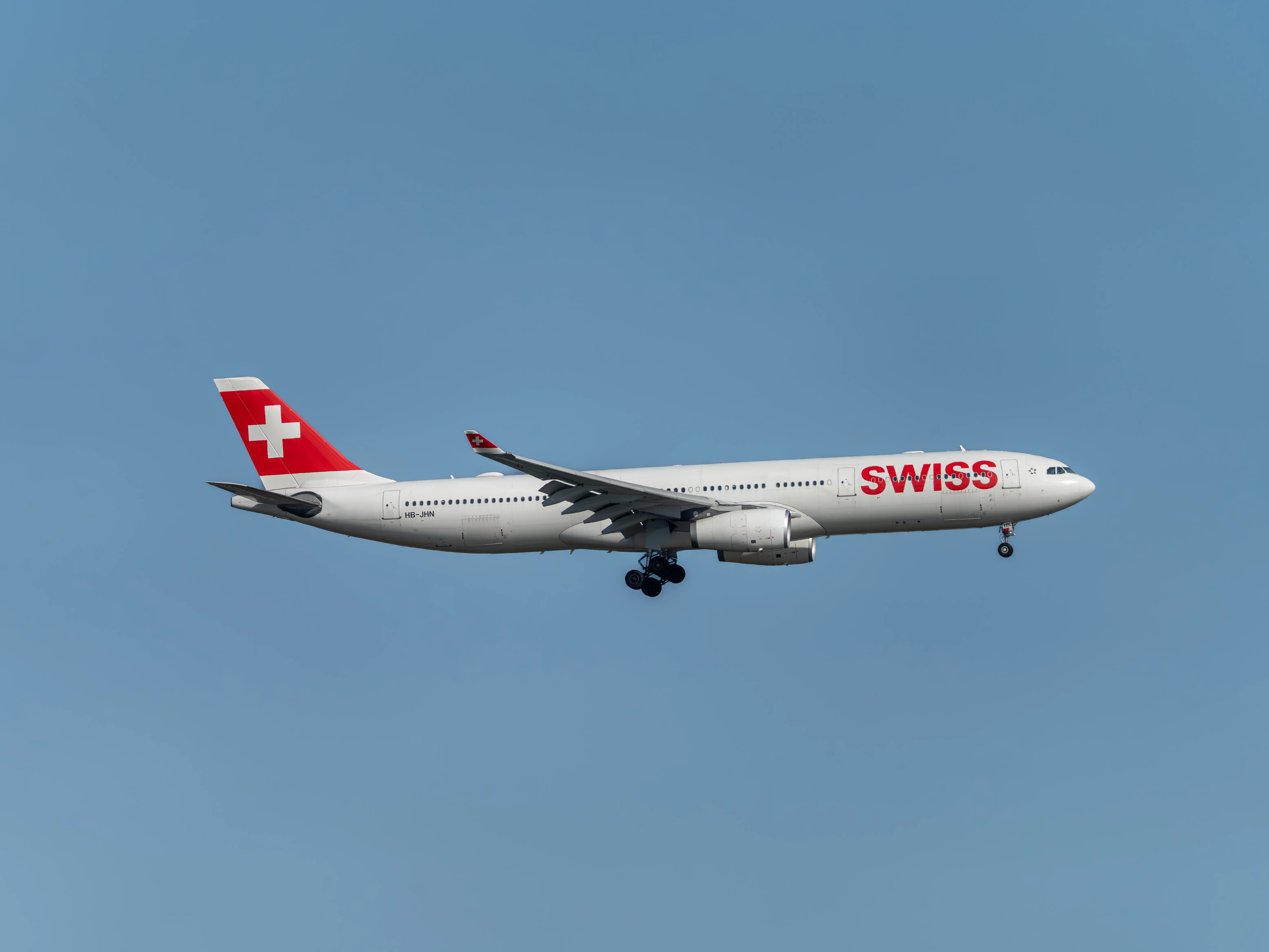 Swiss International Air Lines Airbus A330-343 (registration number HB-JHN) making final approach to the runway 22L