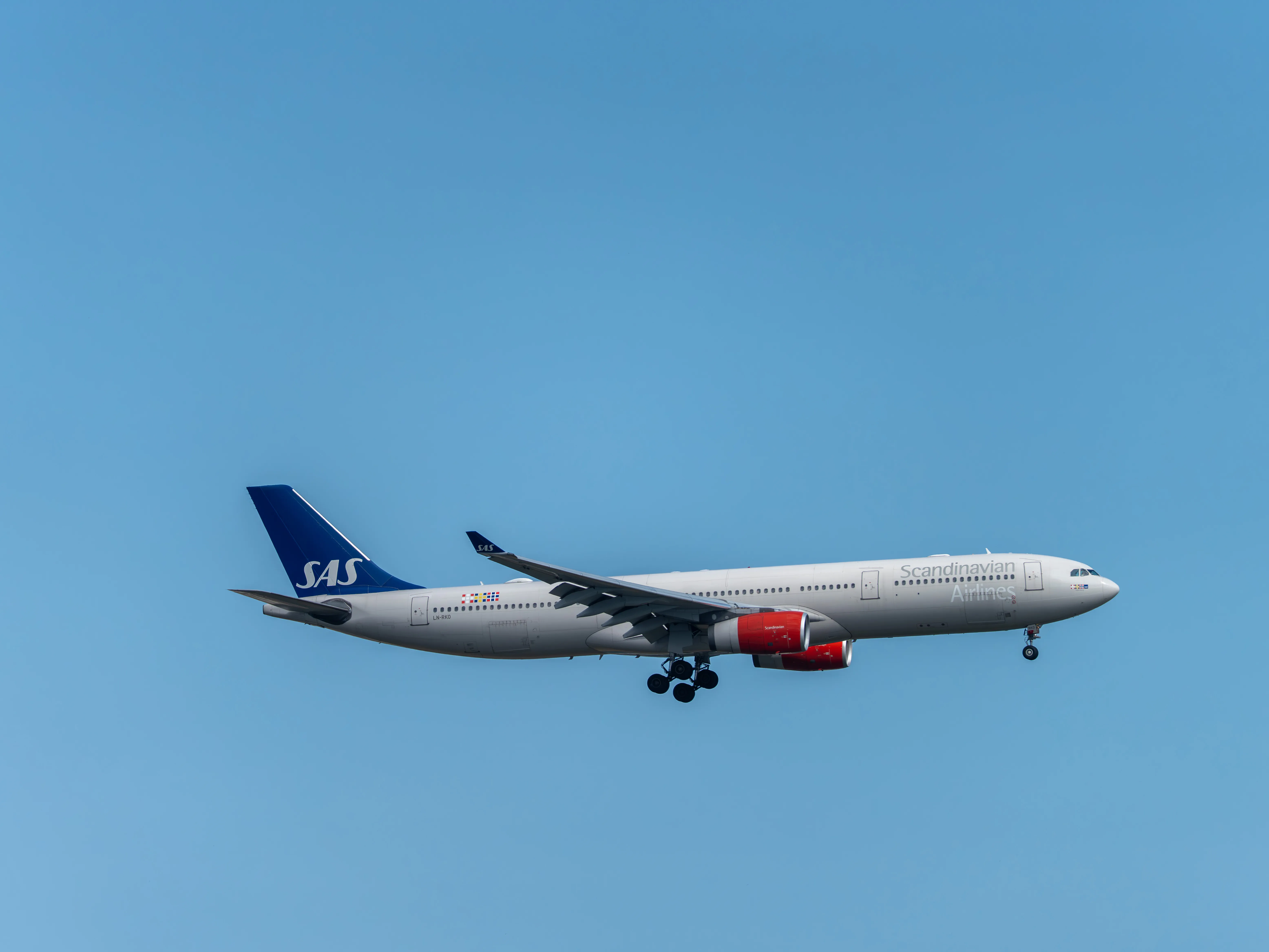 Scandinavian Airlines Airbus A330-343 (registration number LN-RKO) making final approach to the runway 22L