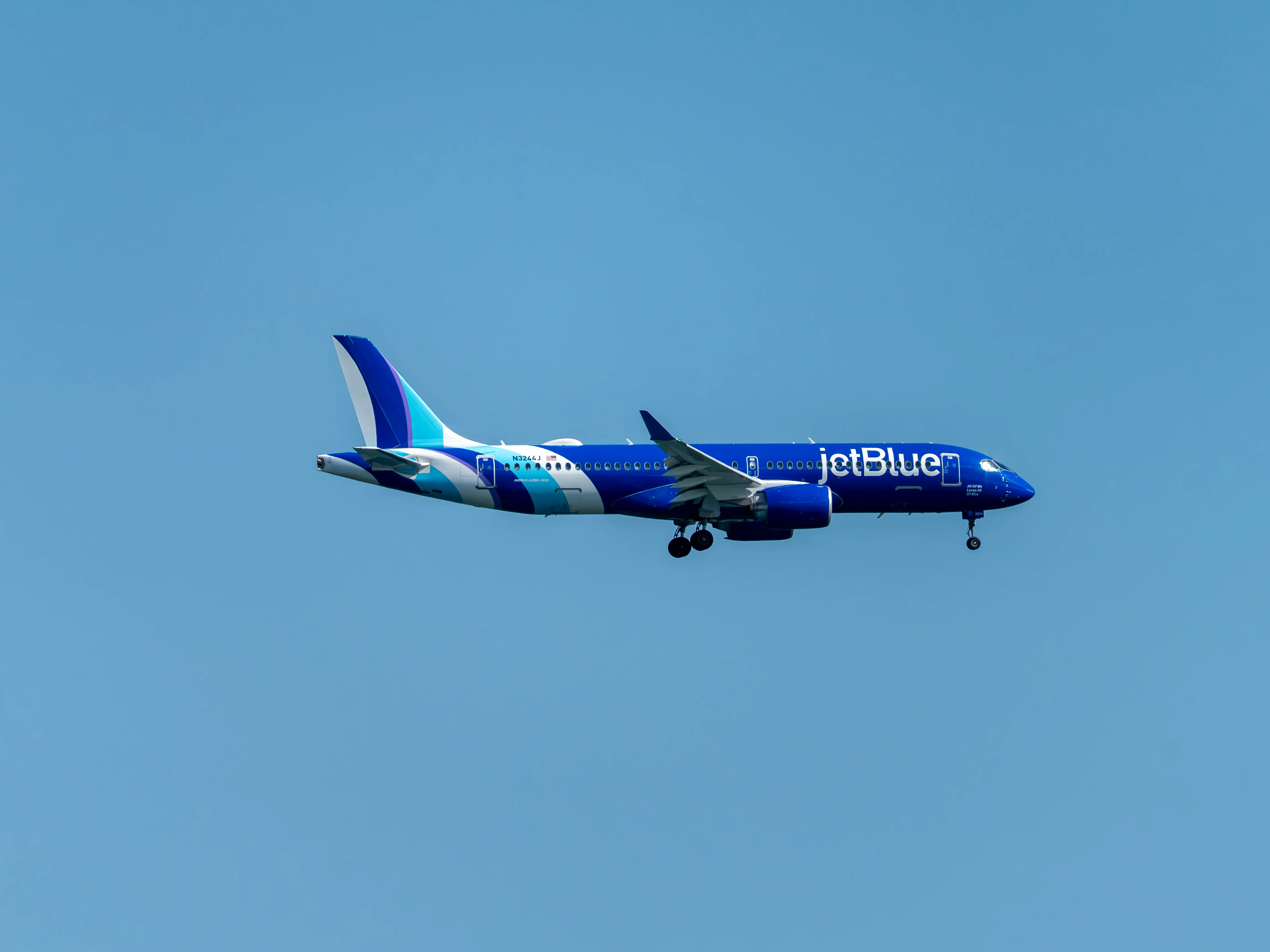 JetBlue Airbus A220-300 (registration number N3244J) making final approach to the runway 22L