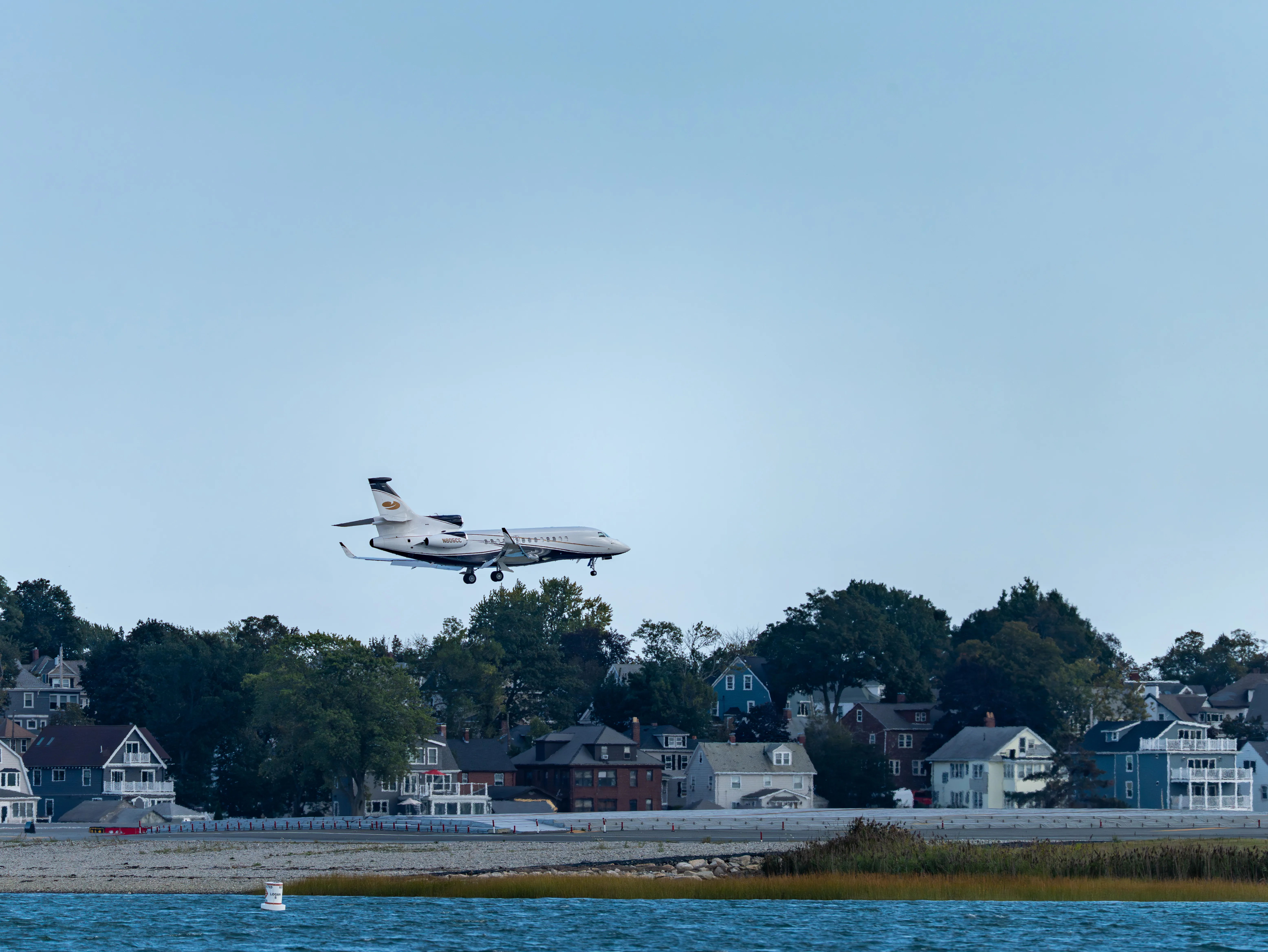 Dassault Falcon 7X (registration number N805CC, private owner) making final approach to the runway 22L