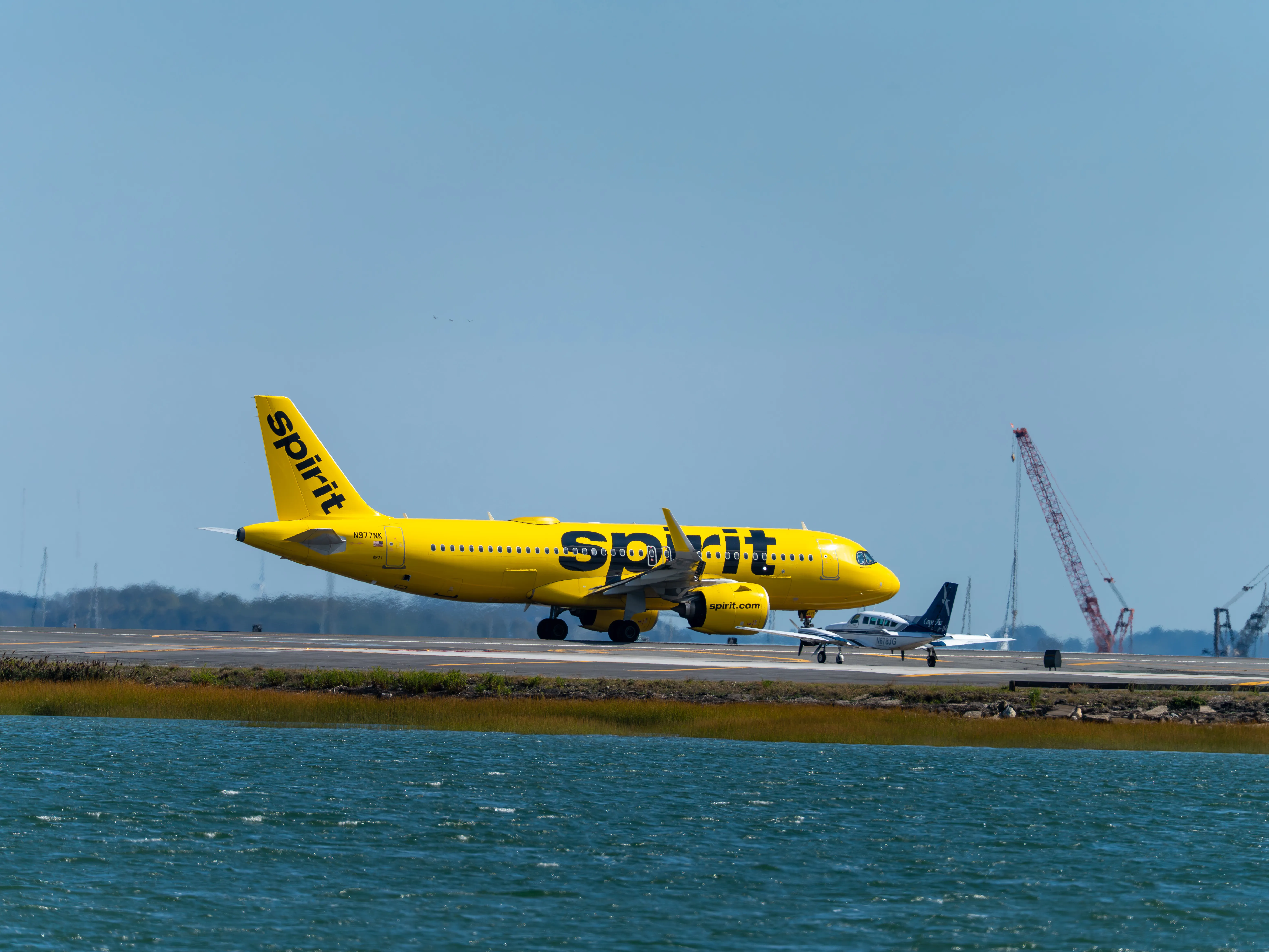 Spirit Airlines Airbus A320-271N (registration number N977NK) lined up on runway 22R for takeoff