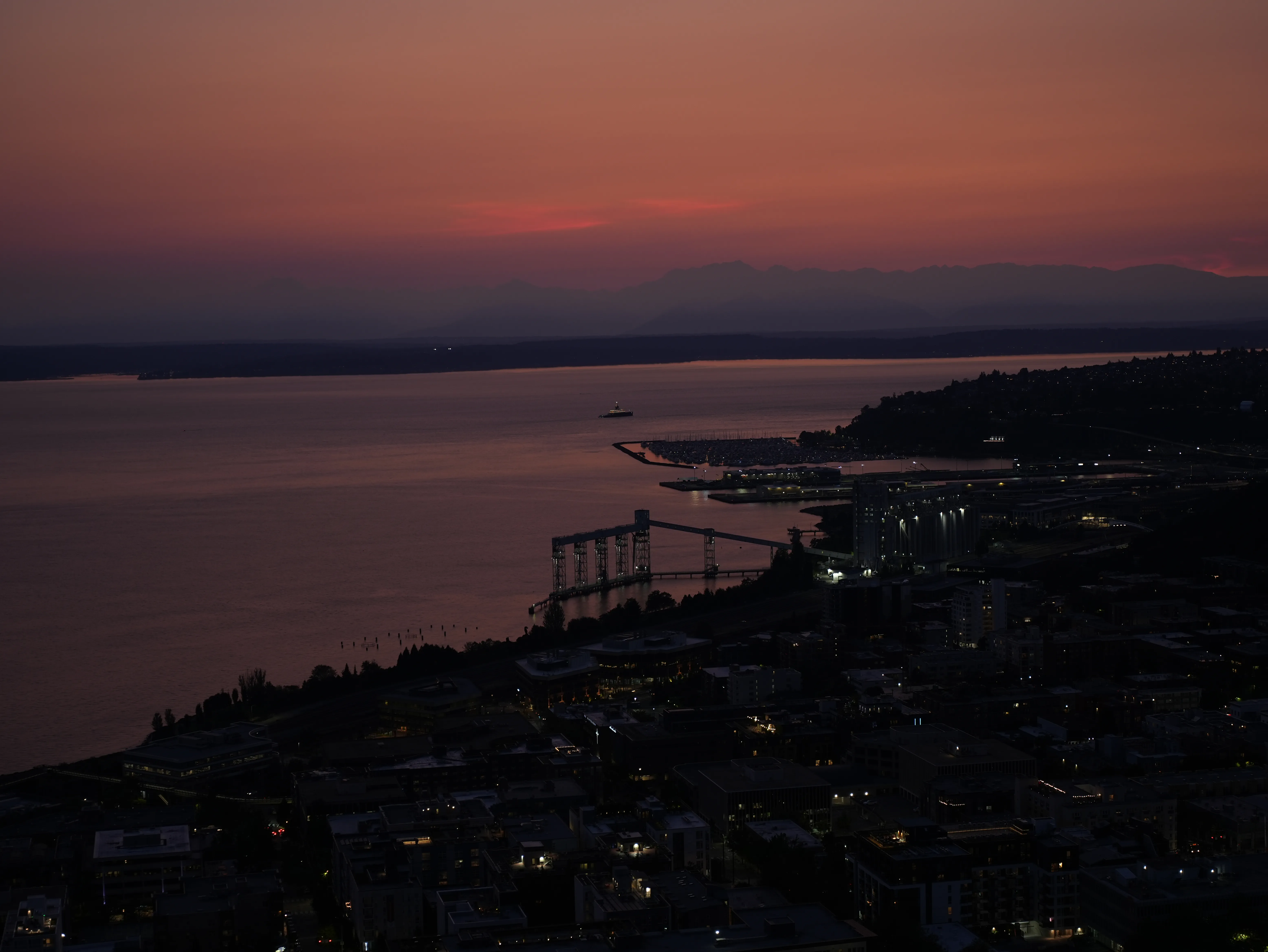 Top view of Seattle, the Ocean and the Olympic Mountains from the Space Needle